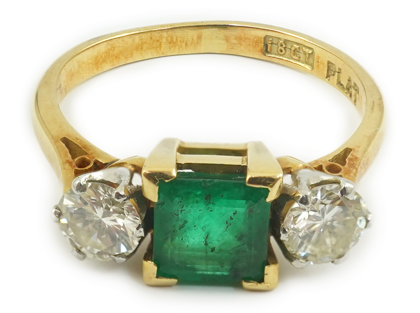 A mid 20th century 18ct gold and platinum, single stone emerald and two stone diamond set ring